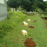 Réalisation de plusieurs tests de perméabilité sur une parcelle pour une étude ANC en Guadeloupe